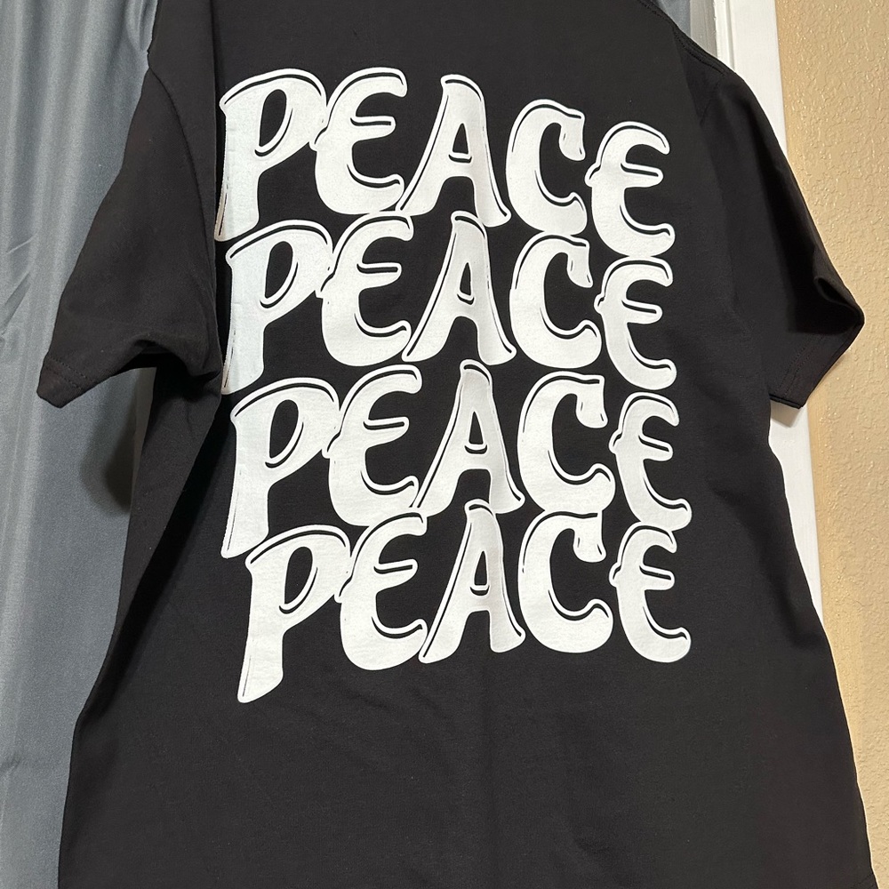 “Peace” Back has puff print outline.